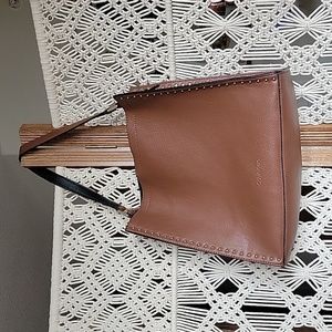 Calvin Klein tote bag. Brown with gold studs front/back. 11" deep 12" wide.
